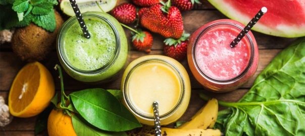 Three fruit smoothies viewed from above